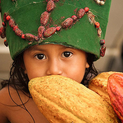 Peru: child with cocoa fruit (horizontal)